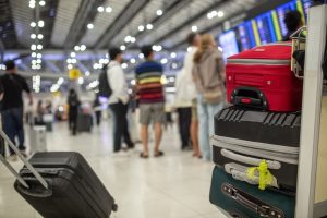 AViewOfAManPushingATrolleyWithFour - Mann Travel