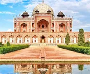 Mughal era red sandstone tomb with a central white dome, flanked by arches, set in a formal garden with a reflecting pool.